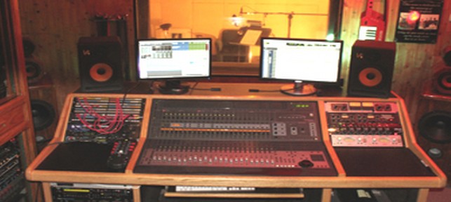 Mixing console and studio monitors in the Deep Signal Studios control room